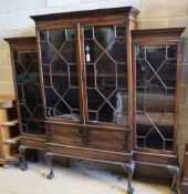 A Chippendale style mahogany breakfront display cabinet fitted four astragal-glazed doors, on