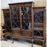 A Chippendale style mahogany breakfront display cabinet fitted four astragal-glazed doors, on