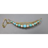 An Edwardian yellow metal, graduated turquoise and diamond set crescent brooch, 52mm, gross 5.3