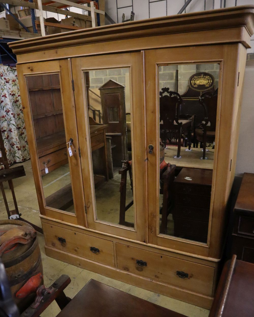 A Victorian pine mirrored triple wardrobe, width 185cm depth 60cm height 206cm