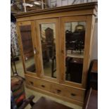 A Victorian pine mirrored triple wardrobe, width 185cm depth 60cm height 206cm