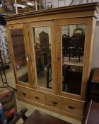 A Victorian pine mirrored triple wardrobe, width 185cm depth 60cm height 206cm