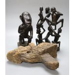 A Luba style wood kneeling figure and two other tribal carvings, tallest 29cm