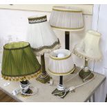 Three Corinthian column table lamps and two others