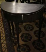 A George III 'D' shaped mahogany folding tea table, width 68cm depth 33cm height 73cm
