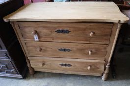 A late 19th century Continental stripped pine chest of three drawers, width 106cm depth 53cm