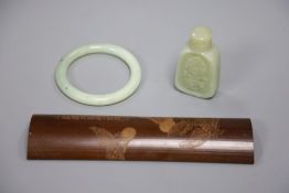 Two jade items and a bamboo tea scoop