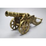 A large brass signal cannon on elaborate carriage, length 42cm