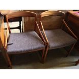 A set of four mid century Danish teak elbow chairs