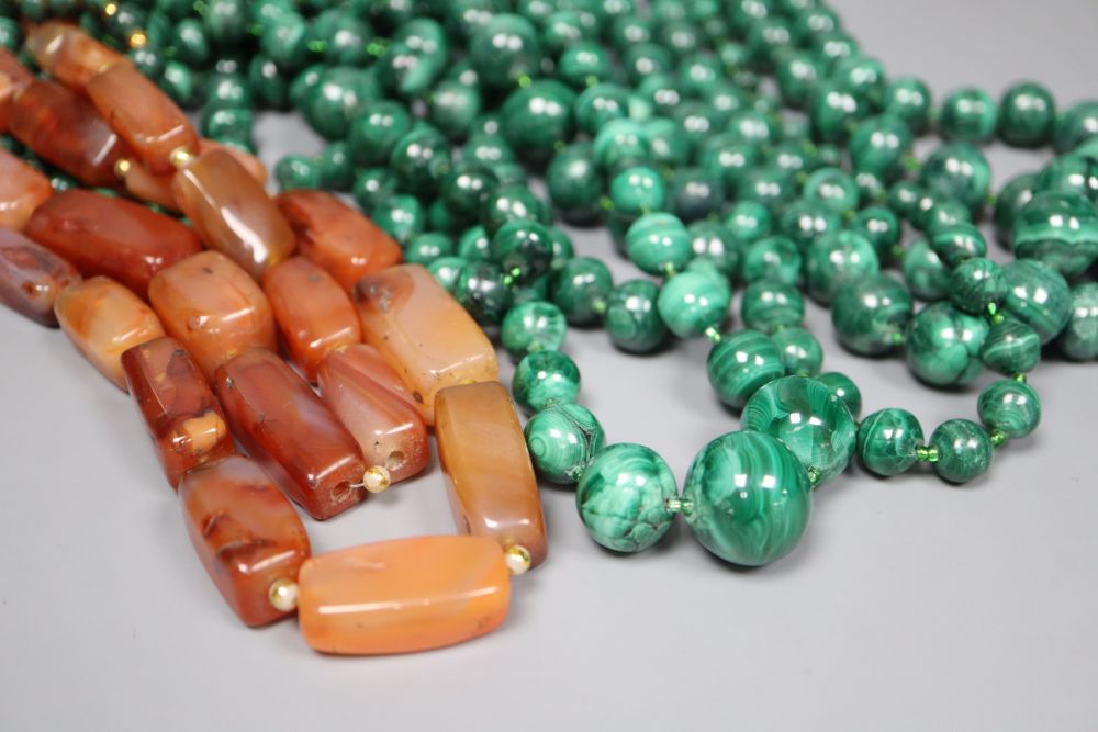 Nine assorted single strand malachite bead necklaces, one with gilt metal spacers and two agate