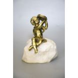 An ormolu seated tambourinist, on granite plinth, 19cm