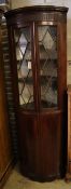 An Edwardian mahogany and boxwood-strung bow-fronted glazed corner cabinet, width 68cm depth 45cm