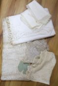 A collection of fine linen mats, lace mats, etc.