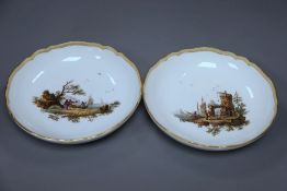 A pair of Meissen dishes with figurative landscape scenes, diameter 20cm