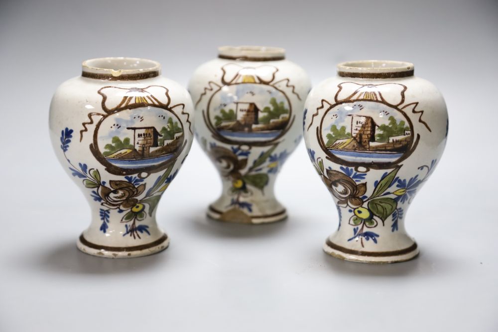 A set of three 19th century Dutch delft baluster jars, painted in colours, 14cmCONDITION: One jar