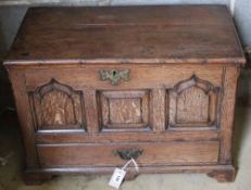 A 19th century oak coffer bach, having detachable planked top over panel front and drawer, width