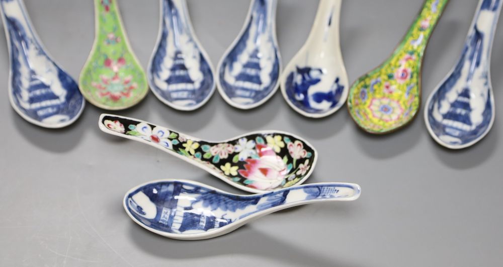 Six Chinese blue and white rice spoons, a famille rose spoon and a Canton enamel spoonCONDITION: All