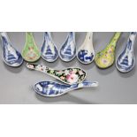 Six Chinese blue and white rice spoons, a famille rose spoon and a Canton enamel spoonCONDITION: All