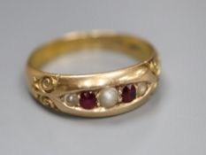 A late Victorian 15ct gold, graduated ruby and split pearl set five stone ring, size M/N, gross 2.