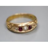 A late Victorian 15ct gold, graduated ruby and split pearl set five stone ring, size M/N, gross 2.