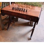 A George III style walnut sofa / games table with sliding reversible top, includes chess and