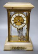 An early 20th century French brass and onyx four glass clock