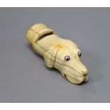 A Victorian ivory hound-head whistle, with glass inset eyes