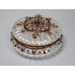 A Victorian yellow metal, cabochon and facet cut garnet mounted circular fluted glass powder jar,