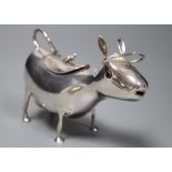 A mid 20th century Dutch white metal cow creamer, length 14cm, gross 145 grams.