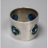 An Edwardian Art Nouveau silver and enamel napkin ring, William Hair Haseler, Birmingham, 1904,