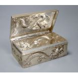 An early 20th century Chinese Export white metal cigarette box, embossed with a dragon, by Wang