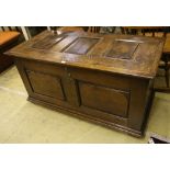 An 18th century panelled oak coffer, width 128cm, depth 61cm, height 64cm