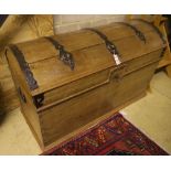 A 19th century pine dome top iron-bound travelling trunk/blanket chest on bun beet, width 128cm,