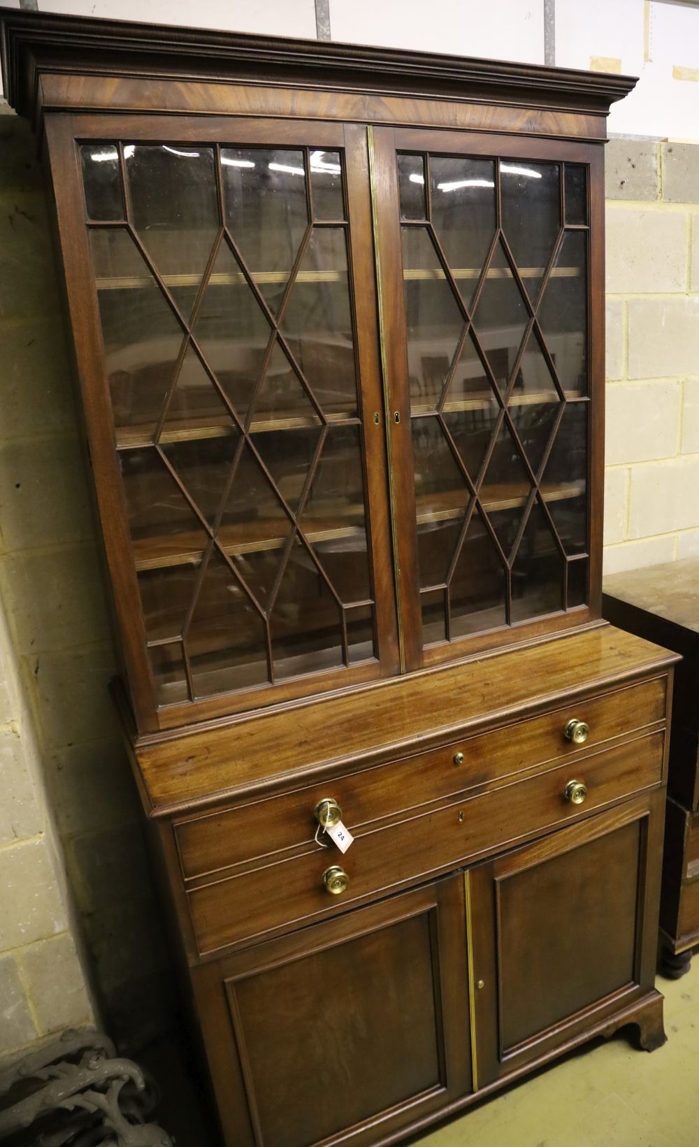 A George III mahogany secretaire bookcase, having astragal-glazed upper section, width 110cm,