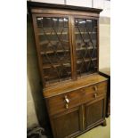 A George III mahogany secretaire bookcase, having astragal-glazed upper section, width 110cm,