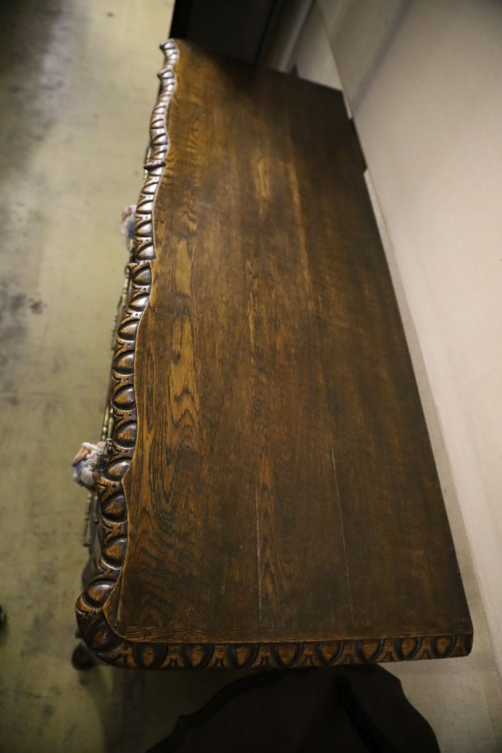 A 20th century French oak commode, fitted four long drawers with carved decoration, width 122cm, - Image 2 of 4