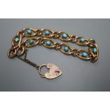 An Edwardian 9ct oval link bracelet, set with ten cabochon turquoise stones, approx. 18cm, gross 9.7