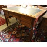 A Continental mahogany writing table, width 120cm, depth 65cm, height 75cm