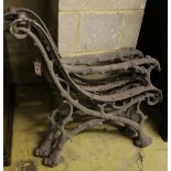 A pair of Victorian cast iron rustic bench ends and a matching central support