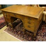 A Queen Anne style walnut kneehole desk, width 128cm, depth 70cm, height 76cm