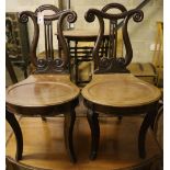 A pair of George IV style mahogany hall chairs
