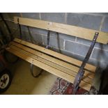 A Victorian wrought iron and ash garden bench with later slatted seat, length 155cm, depth 70cm,