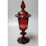 A large Bohemian wheel engraved ruby flash glass vase and cover decorated with deer, late 19th