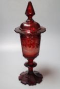 A large Bohemian wheel engraved ruby flash glass vase and cover decorated with deer, late 19th