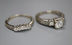 A modern 14k and diamond set engagement ring set, comprising single stone with diamond set shoulders