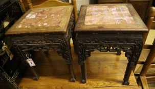 A pair of Chinese rectangular carved and pierced hardwood jardiniere stands with rouge marble