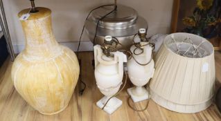 A pair of alabaster lamps, a silver coloured lamp etc