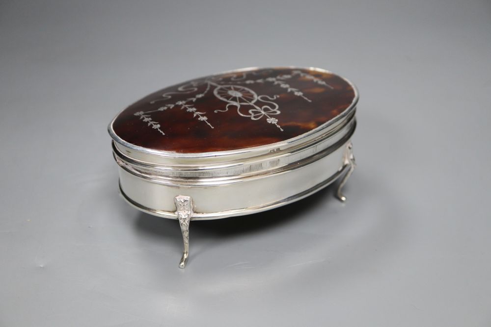 A George V silver and tortoiseshell oval trinket box, Birmingham, 1919, 14.5cm.