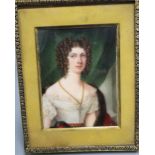 An early 19th century portrait miniature on ivory of a lady, half length, 8 x 6cm, later framed