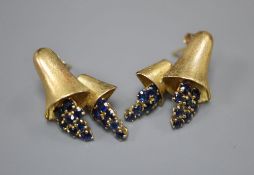 A pair of yellow metal (tests as 18ct) earrings of bell form set with sapphires, 24mm, gross 9.1